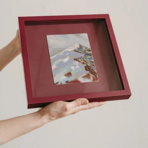 plum coloured square framed pastel study of a colourful mountain