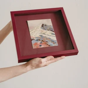 plum coloured square framed pastel study of a colourful mountain